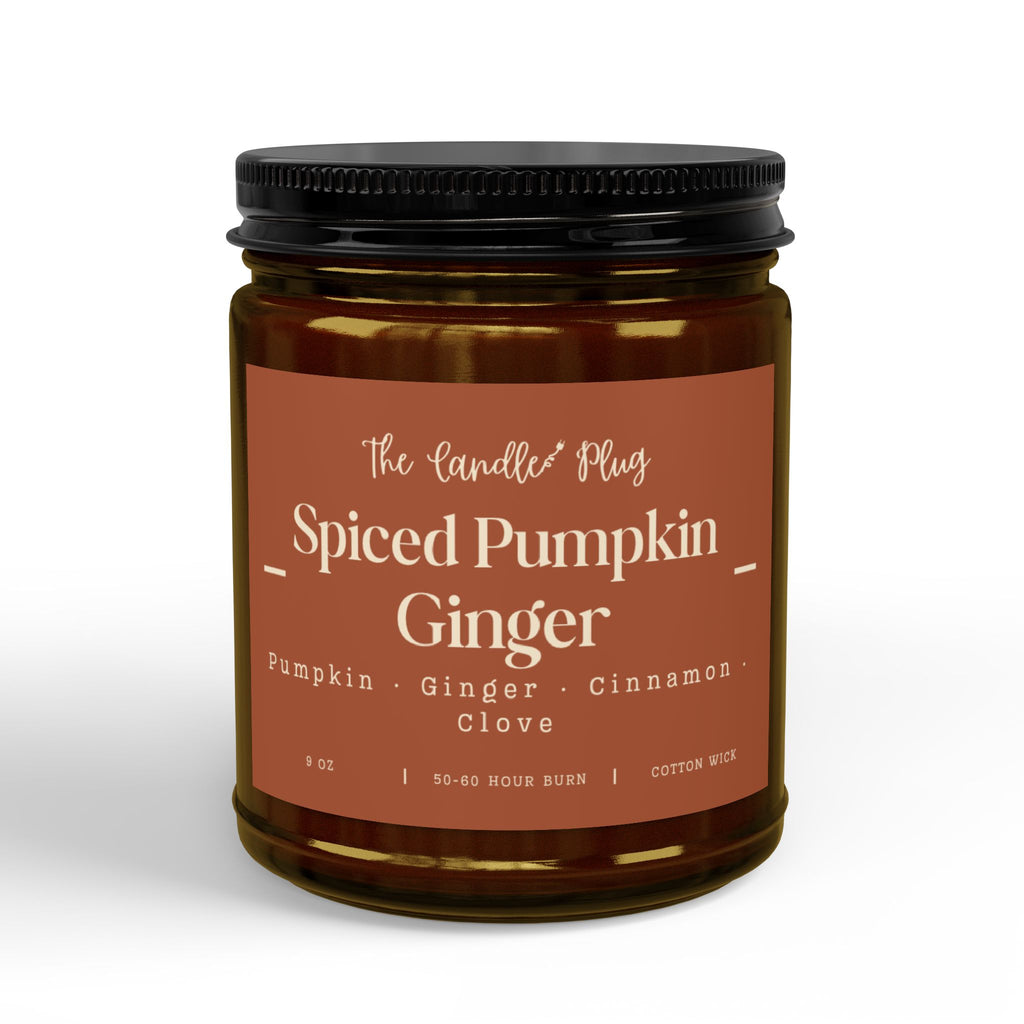 A jar candle with a black lid and a terracotta-colored label reading 'The Candle Plug Spiced Pumpkin Ginger' on a white background.