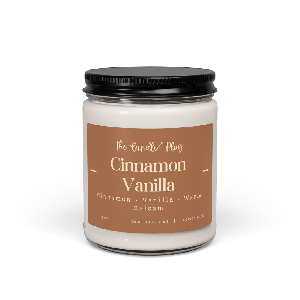 A jar candle with a black screw-on lid and a tan label reading 'The Candle Plug Cinnamon Vanilla' on a clean white background.