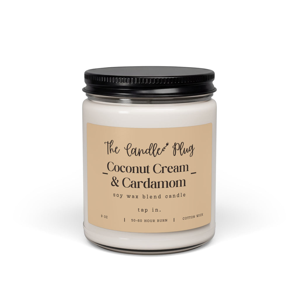 A Coconut Cream and Cardamom soy candle with white wax, a black metal lid, and a beige label reading 'The Candle Plug Coconut Cream & Cardamom' on a clean white background.