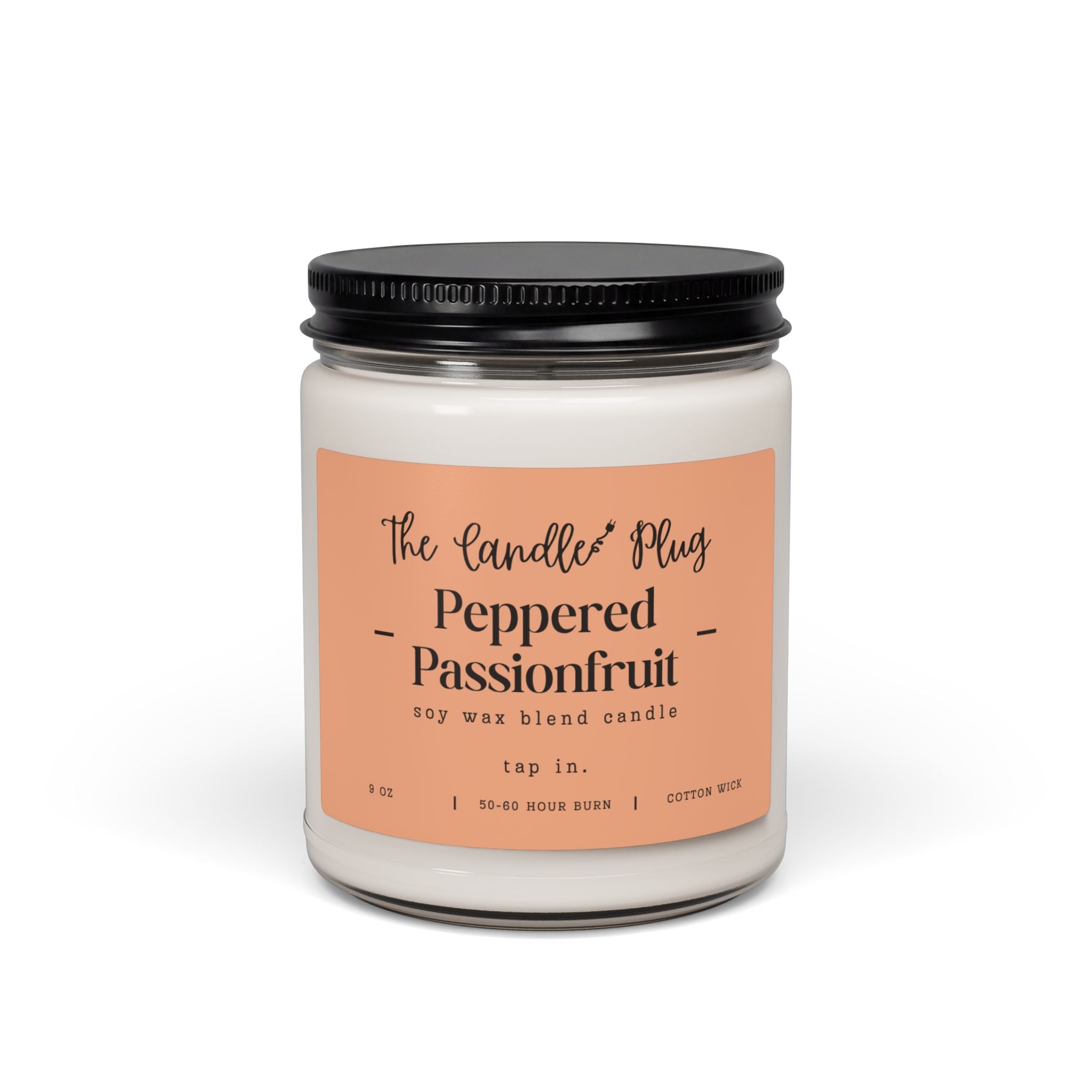 A 9 oz Peppered Passionfruit soy candle in a clear glass jar with a black metal lid and a peach-colored label. The label reads 'The Candle Plug' and 'Peppered Passionfruit'.
